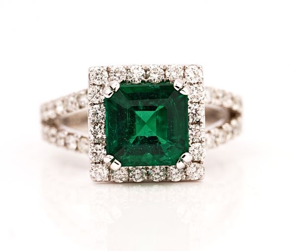An 18ct white gold, emerald and diamond square cluster ring