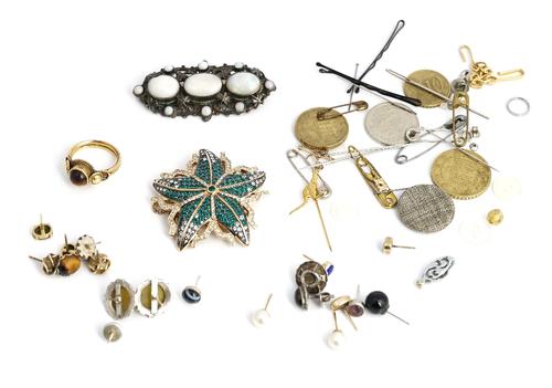 A gold and tiger's eye single stone ring, detailed K 22, a silver and opal brooch, detailed Sterling, a green and colourless paste costume pendant...