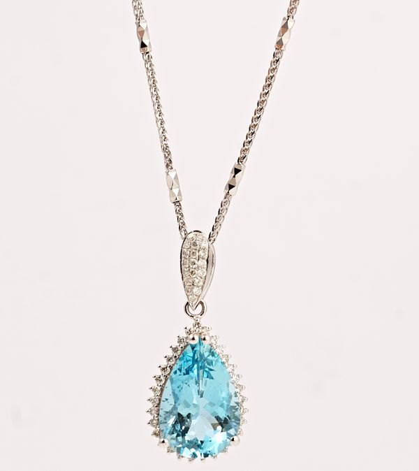 An 18ct white gold, aquamarine and diamond pendant, claw set with the pear shaped aquamarine in a surround of small circular cut diamonds and with a...
