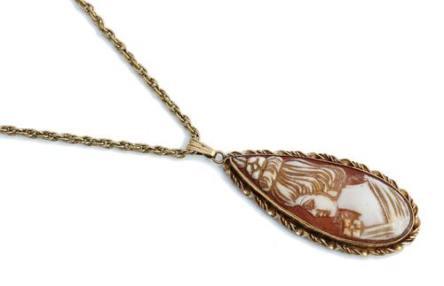 A 9ct gold and shell cameo pendant, carved as the portrait of a lady in a ribbon twist surround, Birmingham 1975, length including suspension loop...