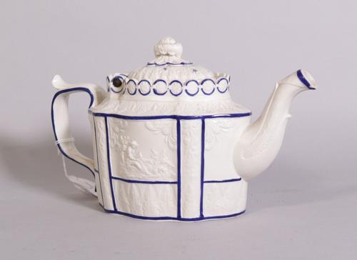 A Castleford salt glaze shaped teapot, circa 1800, banded in blue, 28cm across