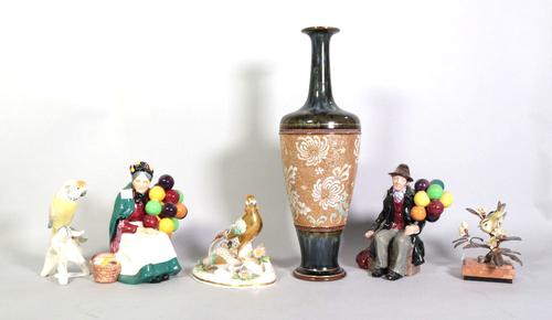 A Royal Doulton tall baluster vase, painted and gilded with flowers against a biscuit ground, the neck and base mottled blue/green, 39cm high,