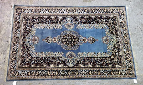 An Indian rug, a blue field with black medallion, 280cm x 182cm