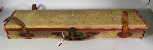 A leather bound canvas shotgun travelling case, 77cm wide, a leg of mutton canvas case, 82cm wide