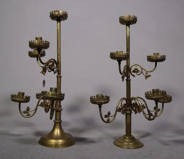A pair of early 20th century brass six branch candlesticks on circular bases, 58cm high