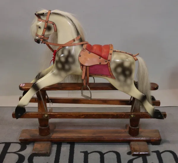 A modern child's rocking horse and two early 20th century dolls prams (3)