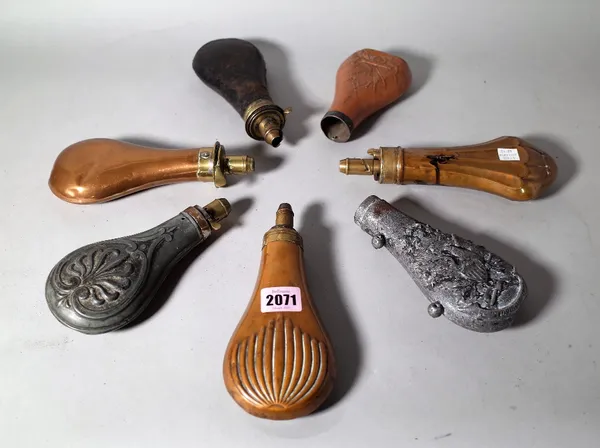 Seven late 19th century powder flasks