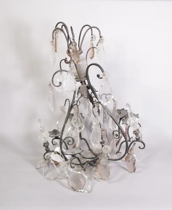 An early 20th century wrought iron chandelier with cut glass faceted drops, 59cm high