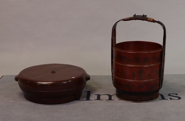 An early 20th century Chinese hardwood three section food box, 70cm high