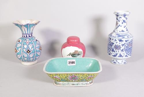 Asian ceramics, an early 20th century famille verte decorated jardiniere. 21cm wide x 7cm high, a 20th century pink ground ginger jar and cover,