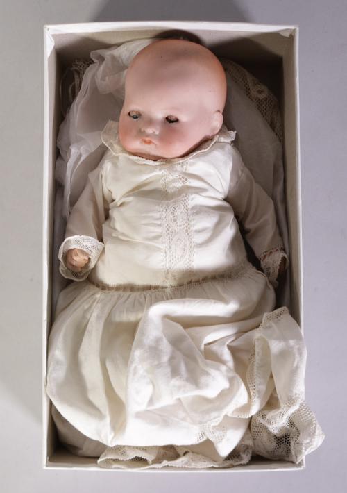An early 20th century German doll with bisque head, 28cm long
