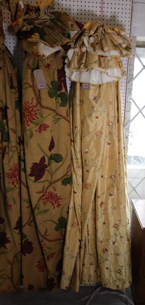Three yellow silk curtains decorated with flowers