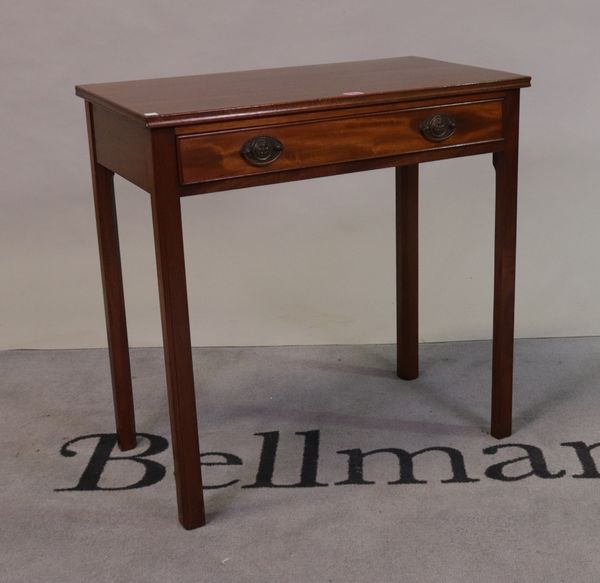 A George III mahogany single drawer side table on canted square supports