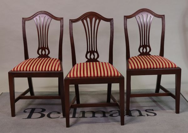 A set of six George III style mahogany pierced splat back dining chairs, on square supports,