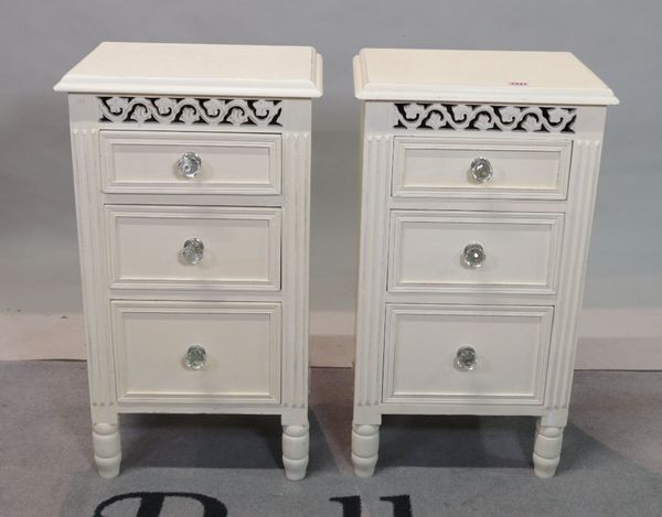 A pair of modern hardwood white painted three drawer bedside chests