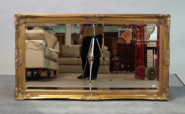 A 20th century gilt framed rectangular mirror, with shell moulded frame