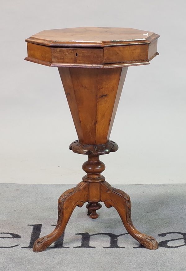 A Victorian walnut trumpet shape work table on tripod base