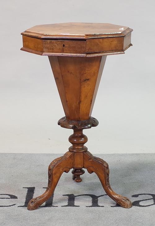 A Victorian walnut trumpet shape work table on tripod base