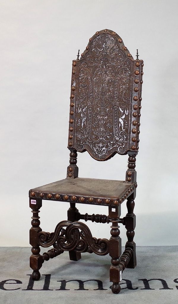 A 19th century continental walnut and embossed leather high back dining chair