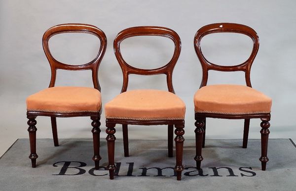 A set of six Victorian mahogany balloon back dining chairs on turned supports