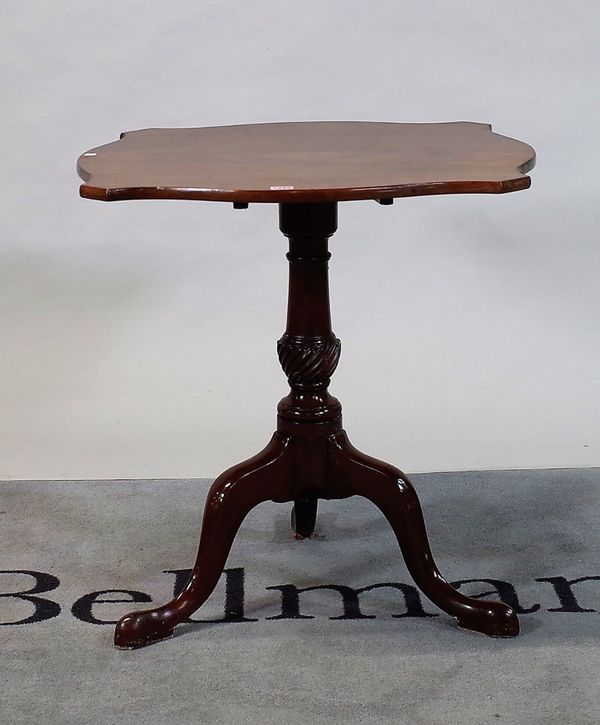 An 18th century and later mahogany occasional table