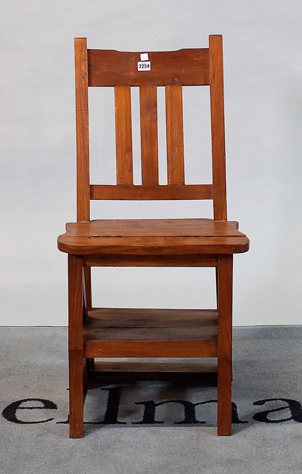 A modern hardwood metamorphic folding chair