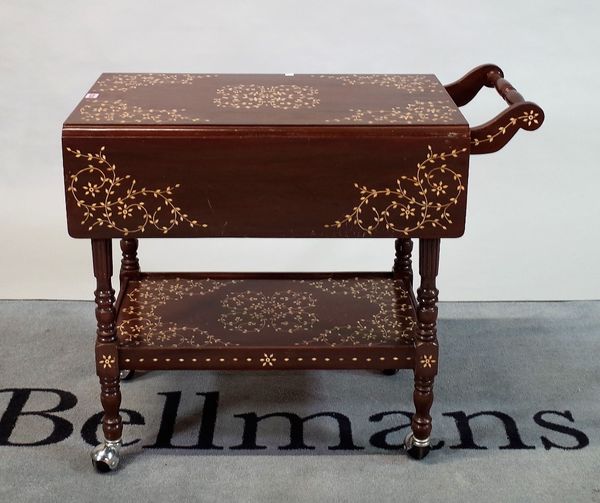 A modern hardwood and resin inlaid two tier serving trolley