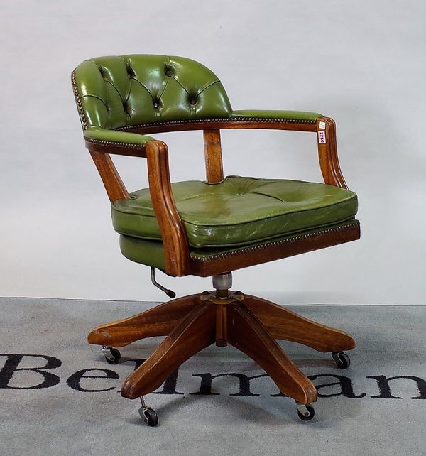 A modern mahogany framed office armchair with button back leather upholstery