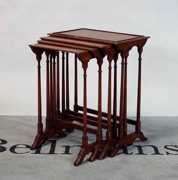 A Regency style mahogany nest of four tables on turned supports