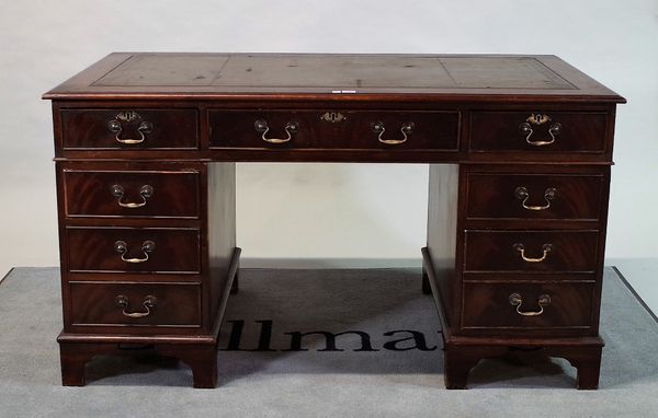 An early 20th mahogany pedestal desk