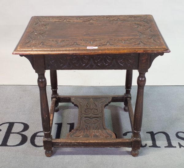 A 17th century style carved oak rectangular occasional table, on turned supports