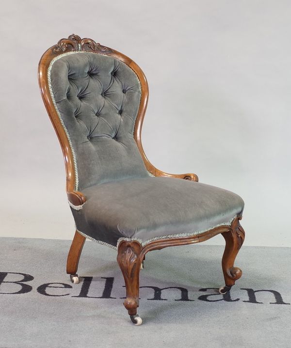 A Victorian mahogany framed nursing chair with buttonback upholstery