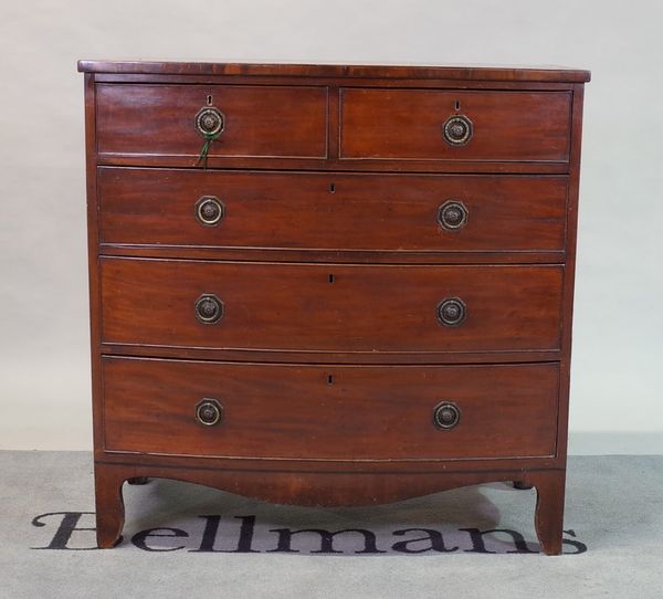 A late George III mahogany bowfront chest of two short and three long graduated drawers,