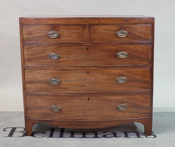 A George III mahogany bowfront chest of two short and three long graduated drawers,