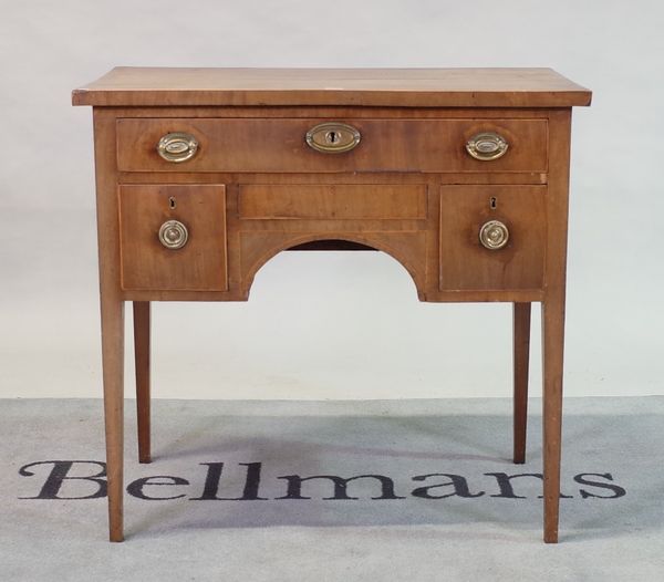 A George III mahogany sideboard with three frieze drawers on tapering square supports,