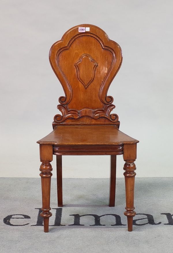 A Victorian mahogany hall chair, with shield back, 45cm wide; 90cm high