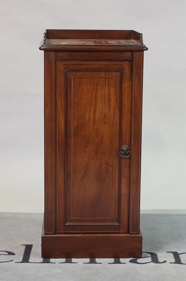 A late Victorian inlaid mahogany galleried bedside table with a single panelled door