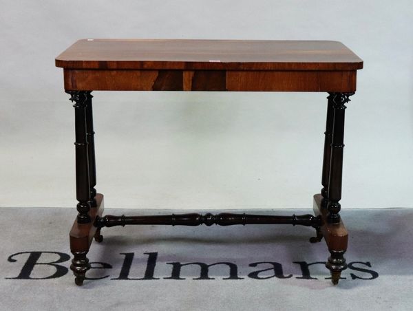 A William IV rosewood centre table on turned supports united by 'H' frame stretcher