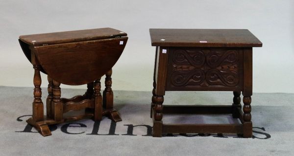 A modern oak lift top joint stool with carved frieze