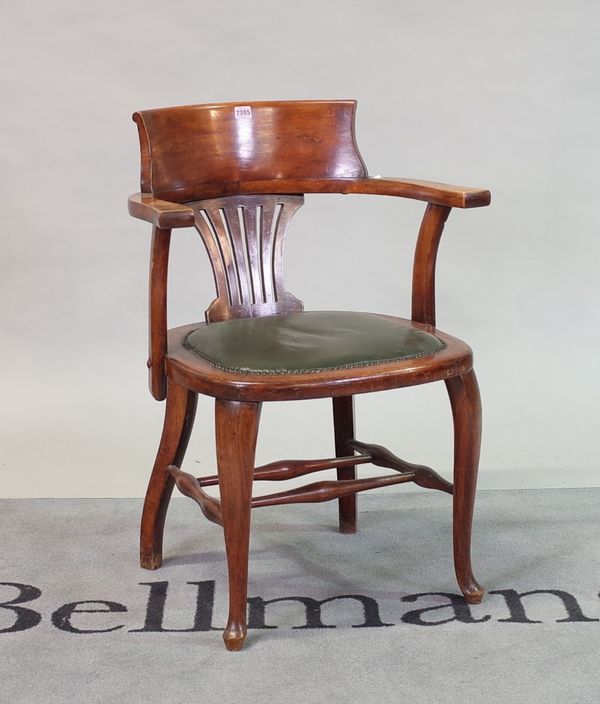 An early 20th century stained beech tub back office chair