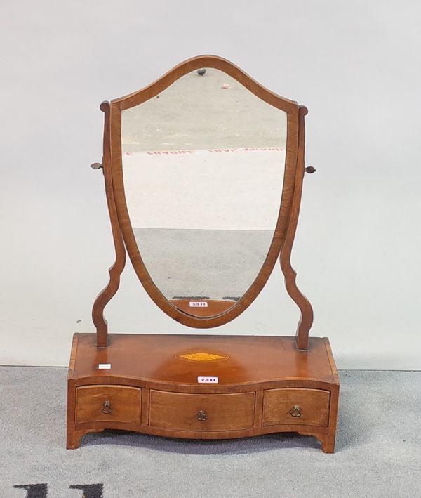 A George III mahogany and satinwood banded serpentine dressing table mirror with three frieze drawers