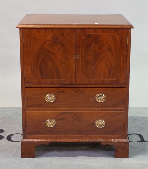 A George III mahogany side cupboard with single drawer base on bracket feet