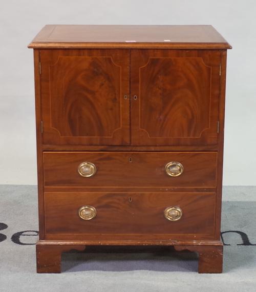 A George III mahogany side cupboard with single drawer base on bracket feet