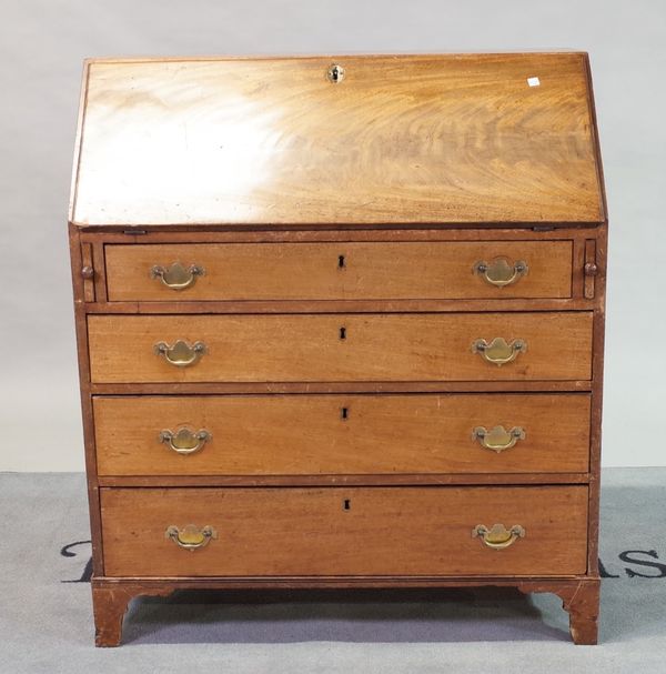 A George III mahogany bureau with fitted interior over four long graduated drawers on bracket feet