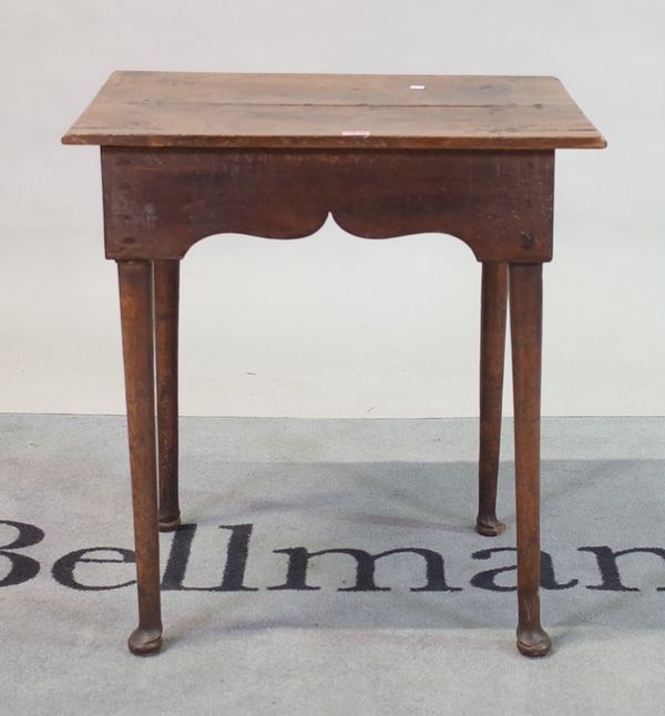 An 18th century and later oak side table on pad feet