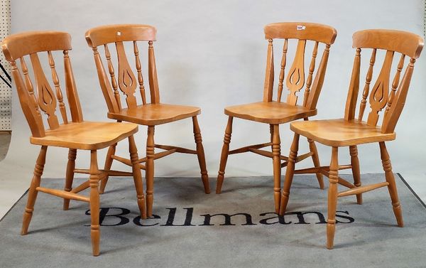 A set of six modern beech and ash stick back dining chairs