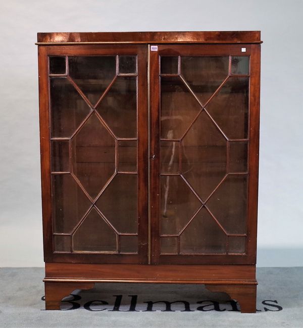 A George III mahogany side cabinet with astragal glazed doors