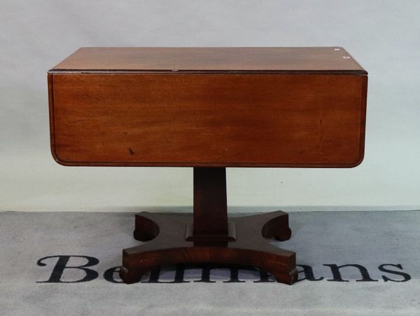 A Victorian mahogany drop flap Pembroke table with square column on quatrefoil base