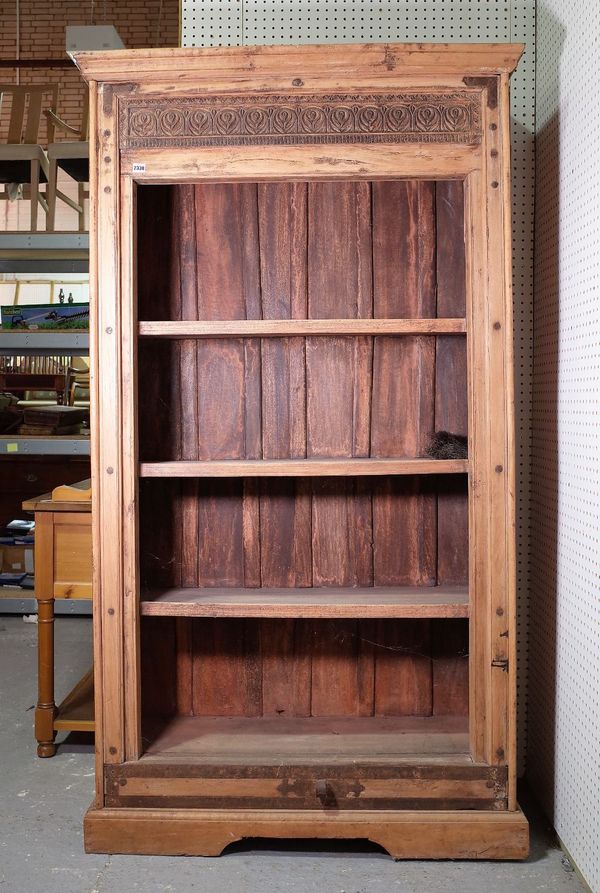 A modern hardwood floorstanding four tier bookcase