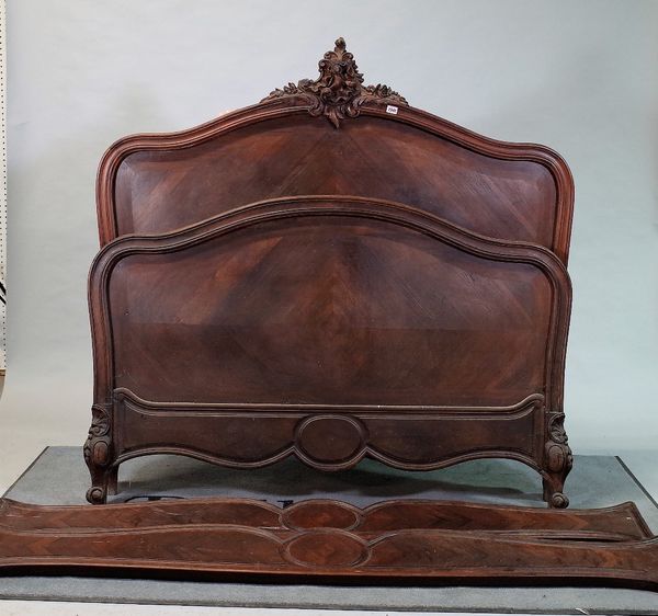 A late 19th century French hardwood arch topped double bed